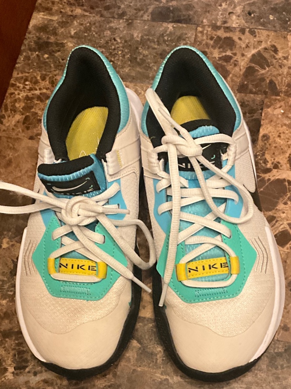 Nike Kids White Sneakers with Teal and Yellow Accents